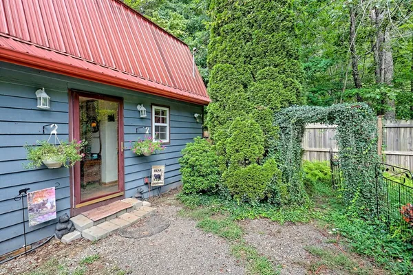 a front view of a house with parking space