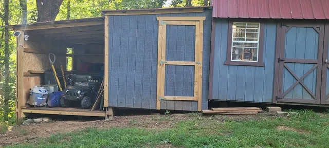 a view of a street with a large tree