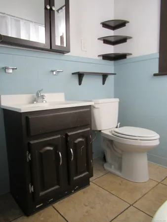 a bathroom with a toilet and a sink