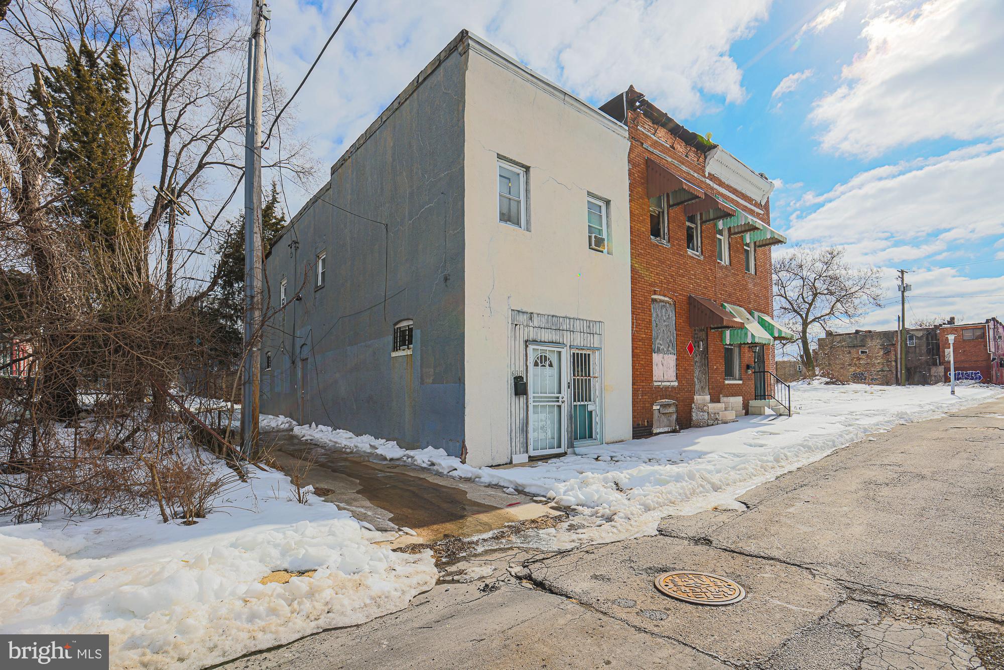 Charming urban duplex with winter backdrop.