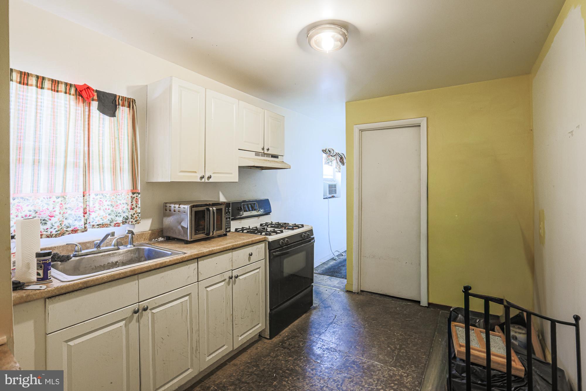 633 North Brice Street Baltimore, MD 21217 - Photo 15 of 28 Cozy kitchen with natural light and charm.