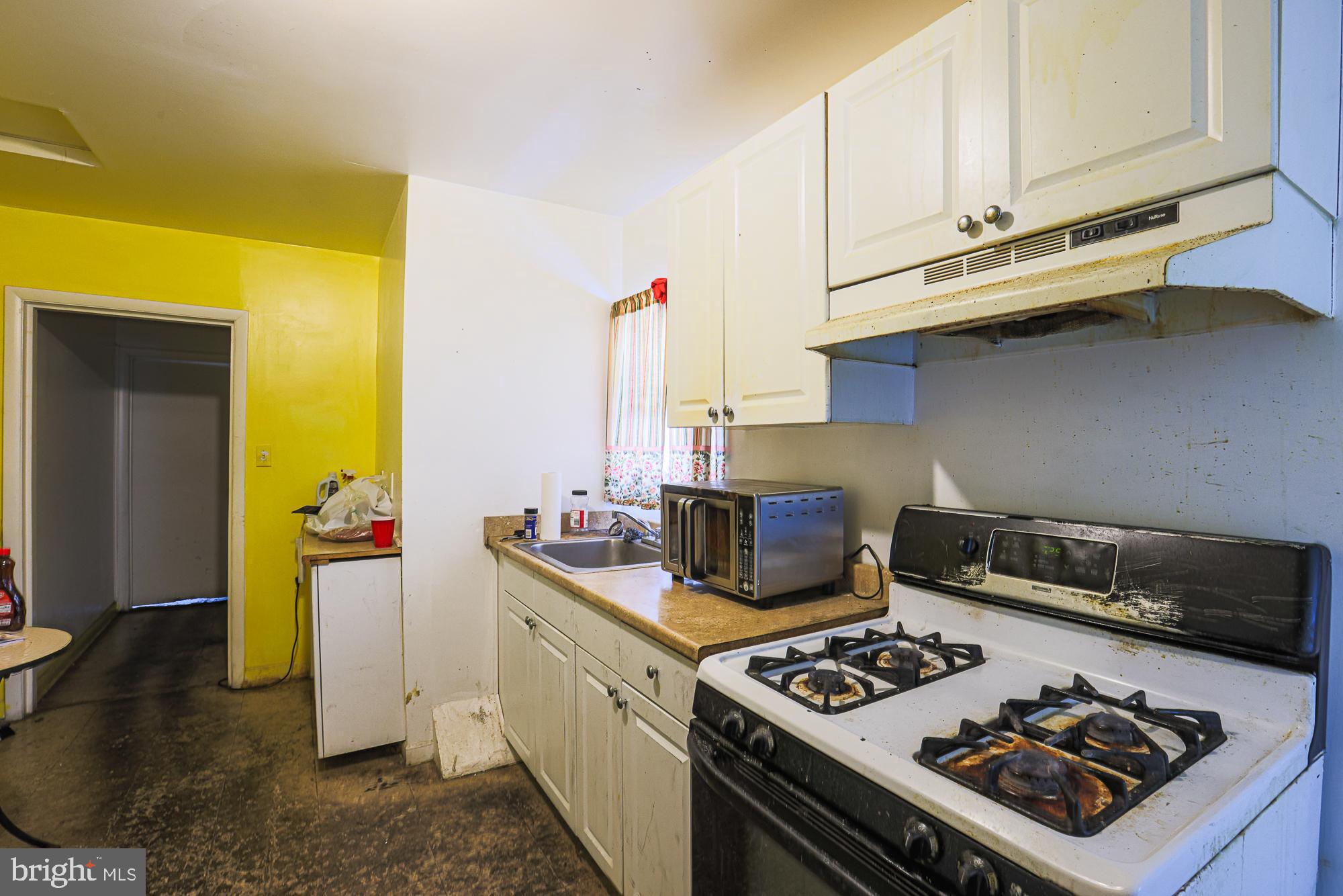 633 North Brice Street Baltimore, MD 21217 - Photo 17 of 28 Bright kitchen with a pop of yellow.