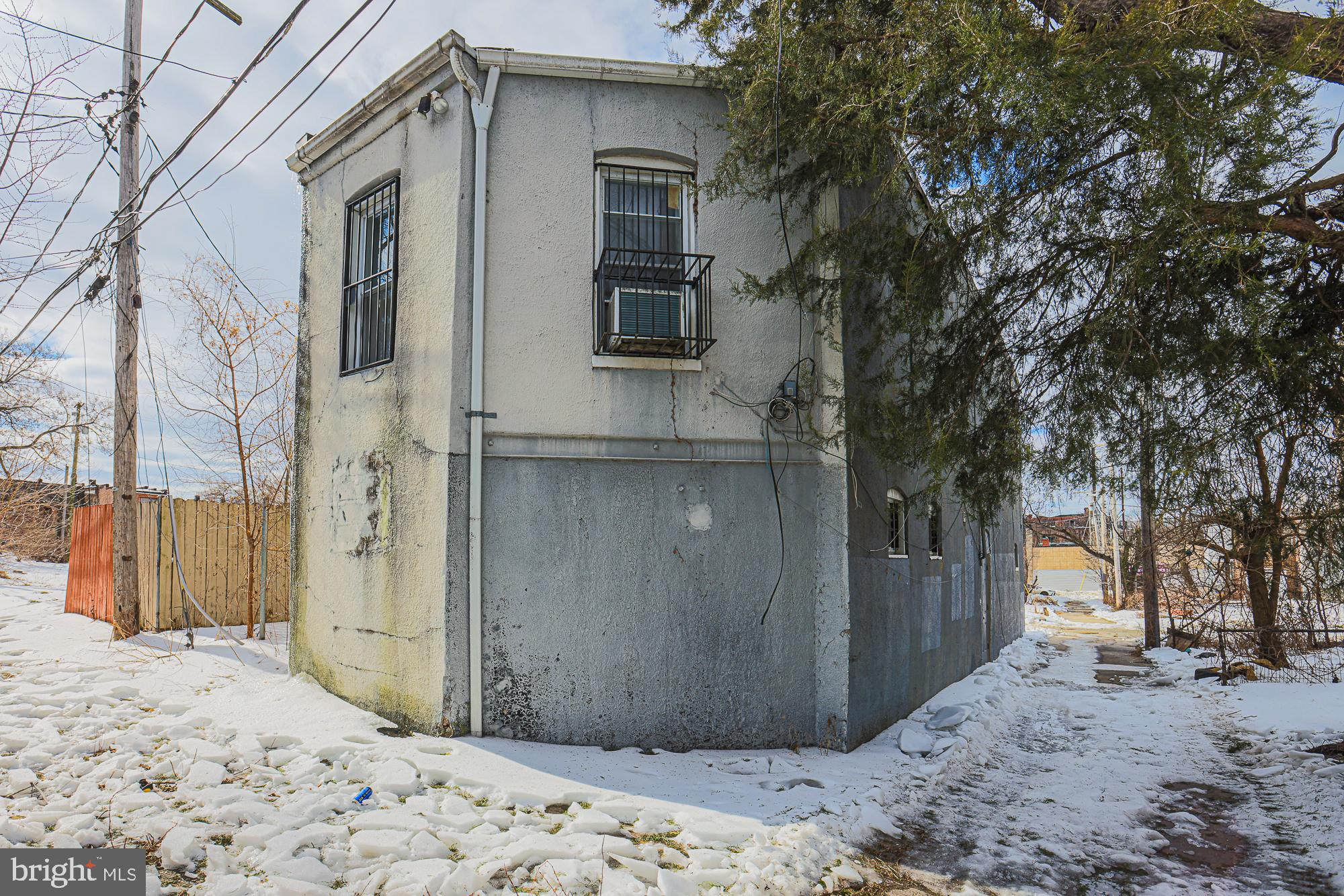 633 North Brice Street Baltimore, MD 21217 - Photo 5 of 28 Historic charm meets winter's embrace.