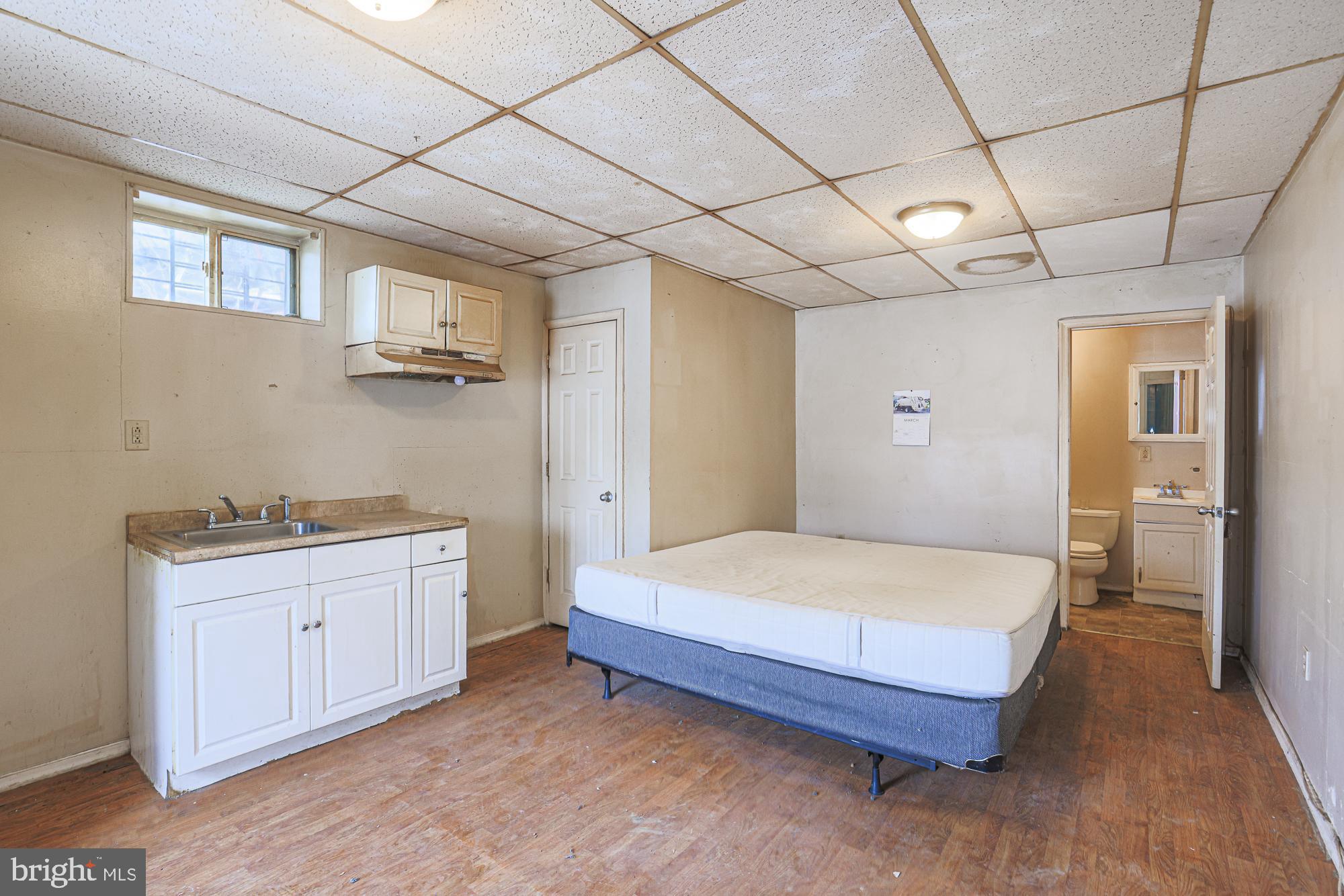 633 North Brice Street Baltimore, MD 21217 - Photo 6 of 28 Cozy space with kitchen and bath access.