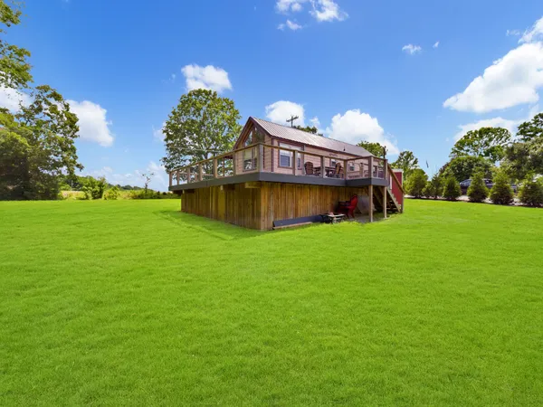 a view of a house with a big yard