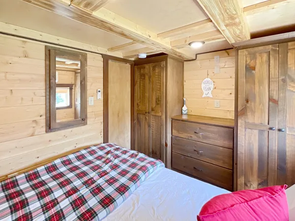 a bedroom with furniture and a window