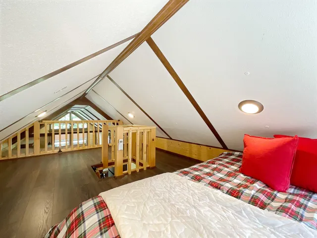 a view of a garden with a house in the background