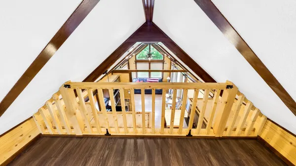a view of house with entertaining space and a ocean view in the back