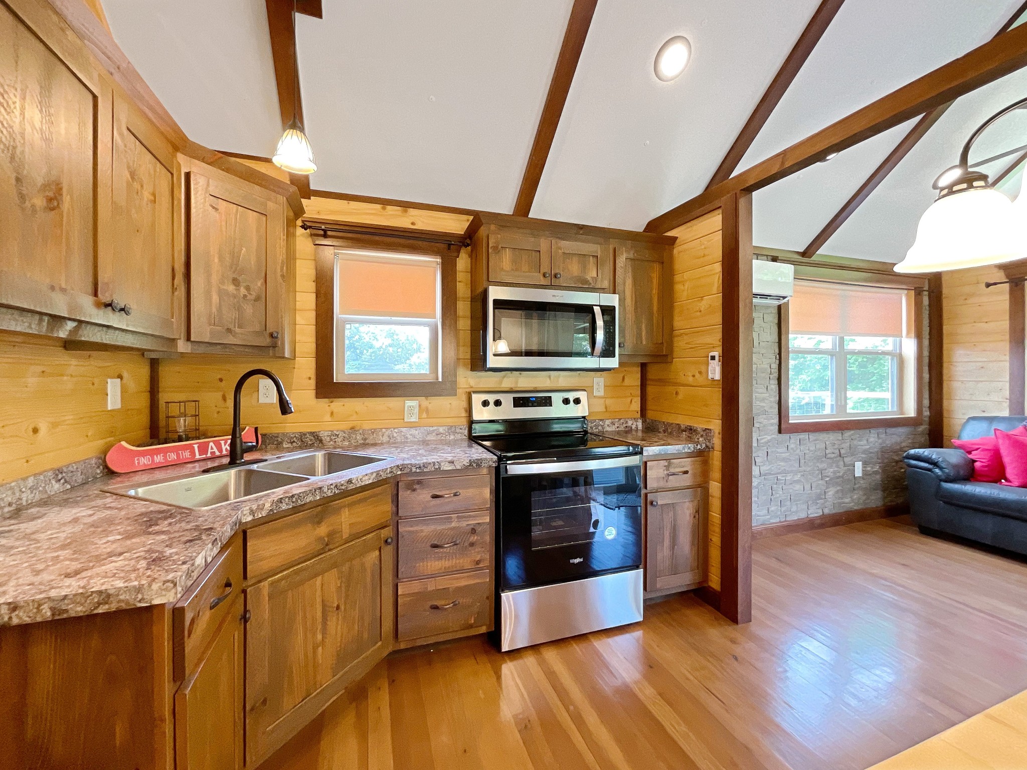 836 Prizer Point Road Cadiz, KY 42211 - Photo 36 of 82 a kitchen with stainless steel appliances granite countertop a stove top oven a sink dishwasher and white cabinets with wooden floor