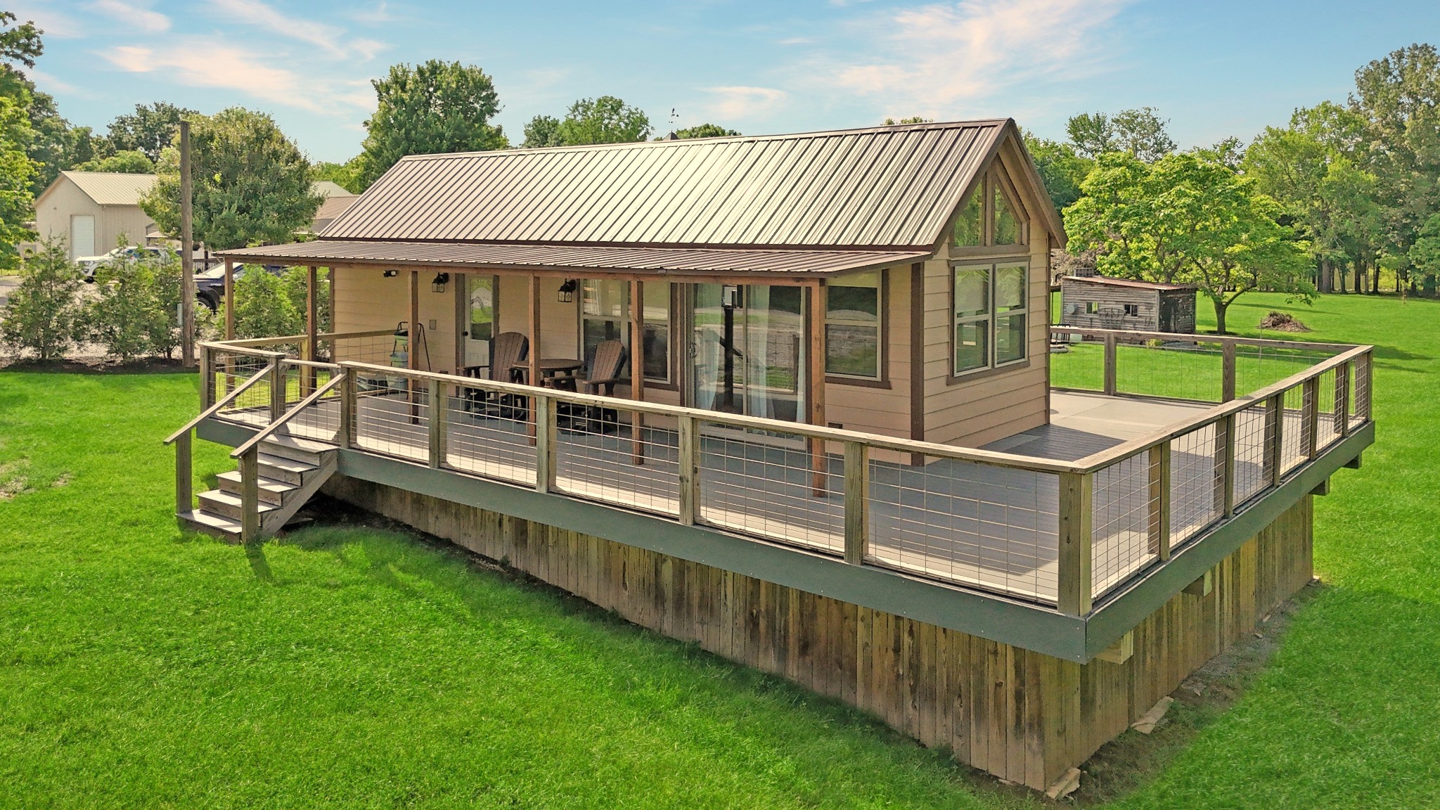 836 Prizer Point Road Cadiz, KY 42211 - Photo 45 of 82 a view of a house with wooden deck and a big yard