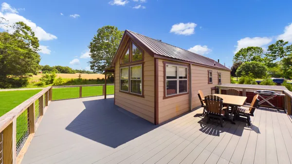 a view of outdoor space with deck and yard
