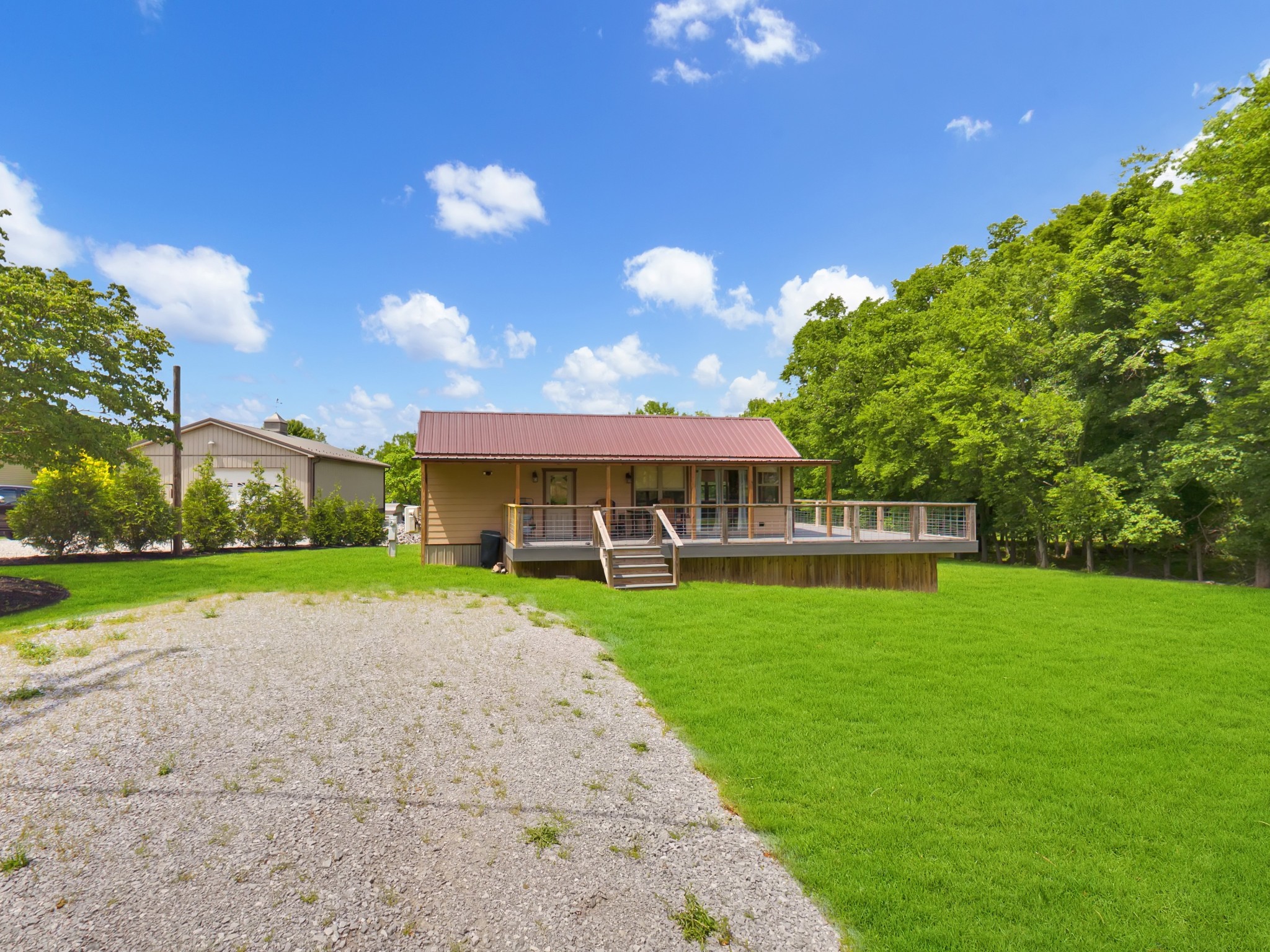 836 Prizer Point Road Cadiz, KY 42211 - Photo 5 of 82 a view of a house with a big yard and potted plants