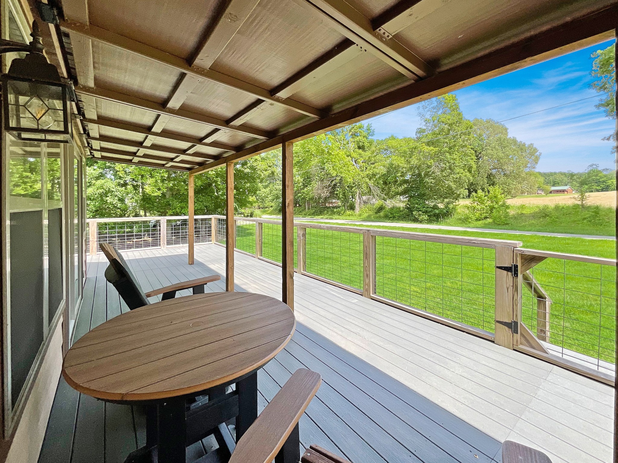 836 Prizer Point Road Cadiz, KY 42211 - Photo 7 of 82 a view of a deck with a table and chairs next to a yard