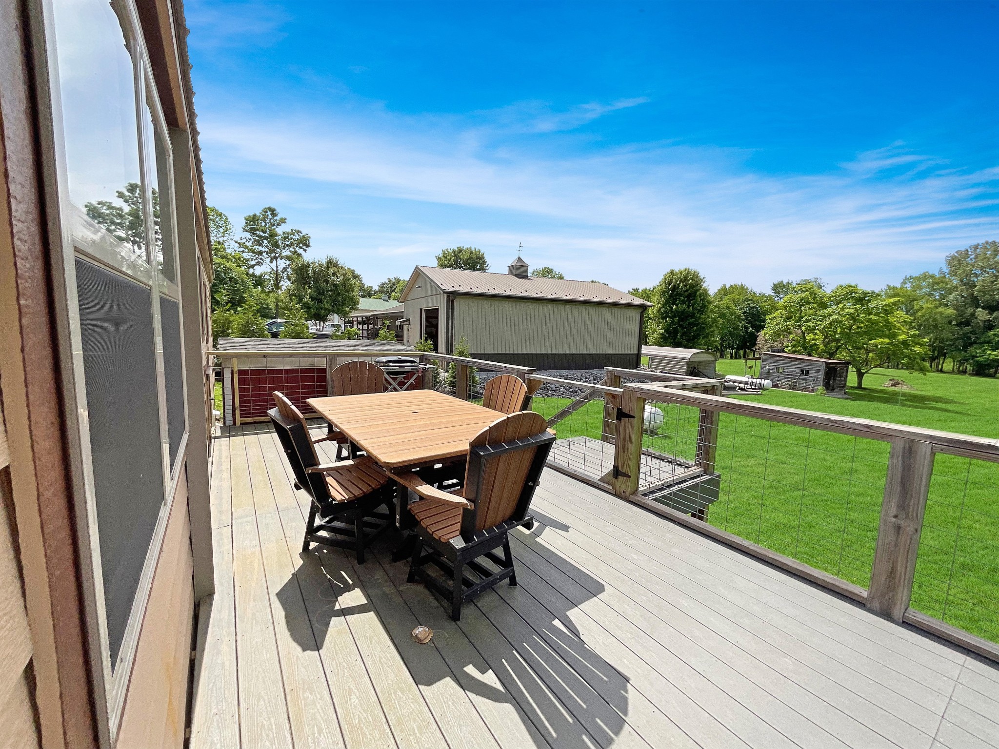 836 Prizer Point Road Cadiz, KY 42211 - Photo 73 of 82 a roof deck with table and chairs a barbeque with wooden floor and fence