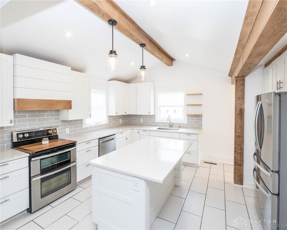 190 Swailes Road Troy, OH 45373 - Photo 7 of 82 This bright kitchen features exposed wooden beams and sleek, contemporary finishes.