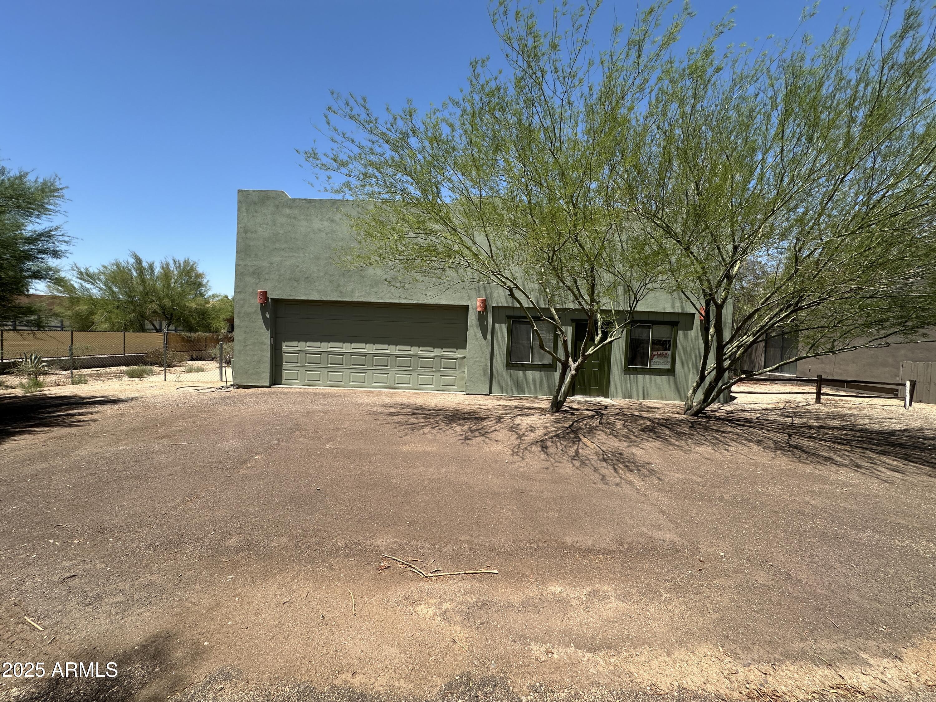 30814 North Sunrise Ranch Road, Unit GUEST Cave Creek, AZ 85331 - Photo 1 of 9 a view of a house with a yard and garage