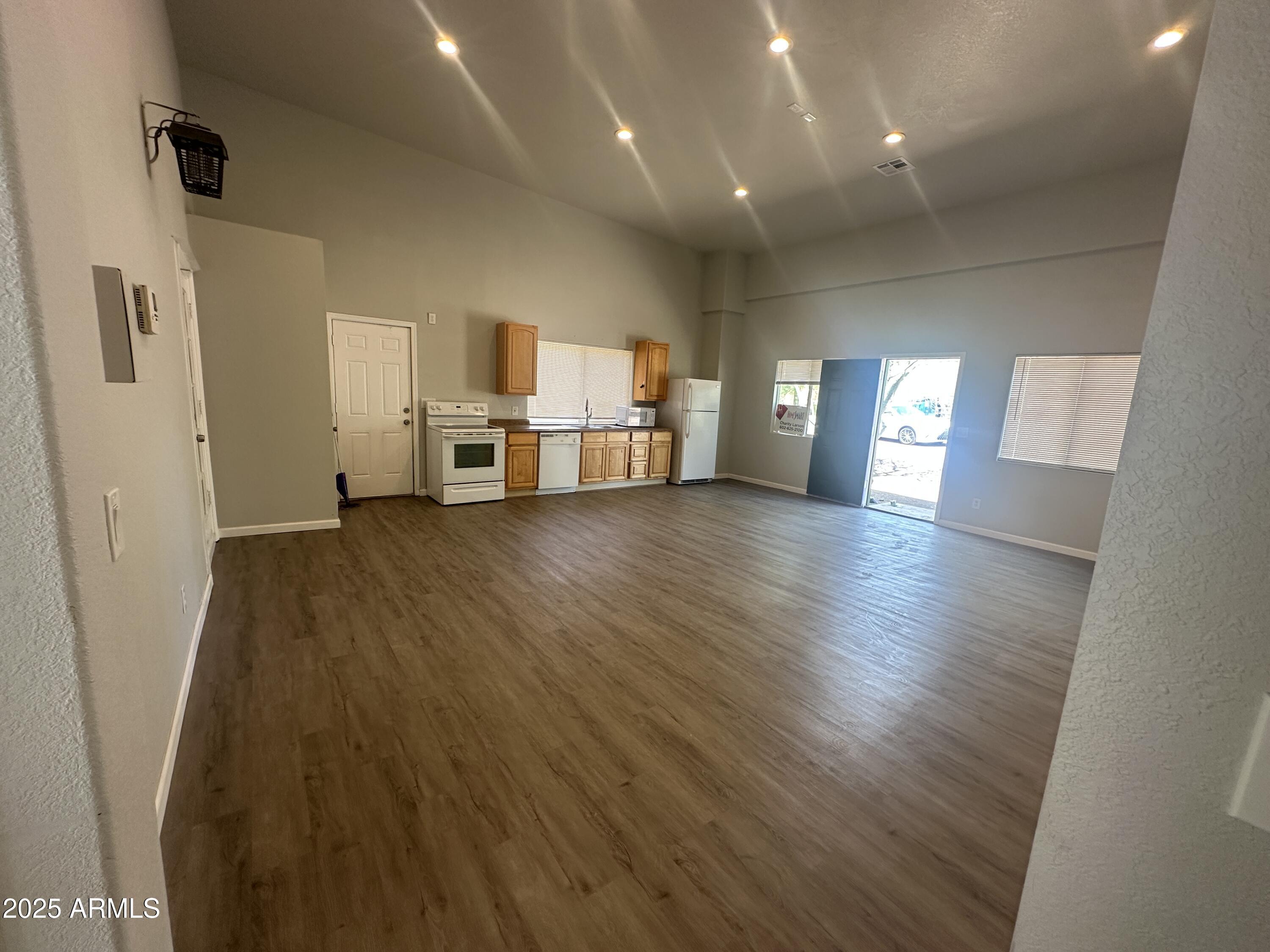 30814 North Sunrise Ranch Road, Unit GUEST Cave Creek, AZ 85331 - Photo 2 of 9 a view of a kitchen with furniture and wooden floor