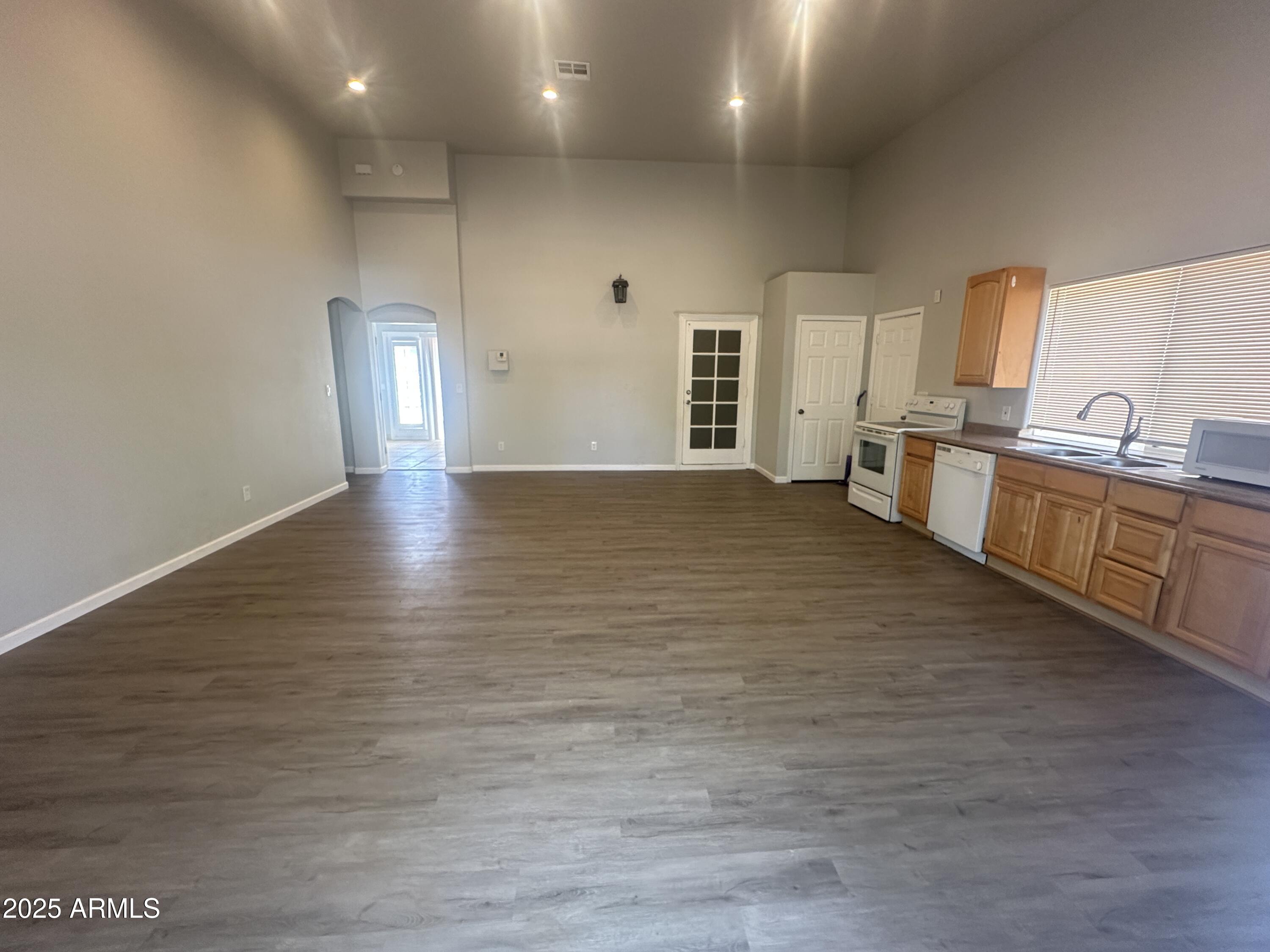30814 North Sunrise Ranch Road, Unit GUEST Cave Creek, AZ 85331 - Photo 3 of 9 a large kitchen with lot of counter space and wooden floor