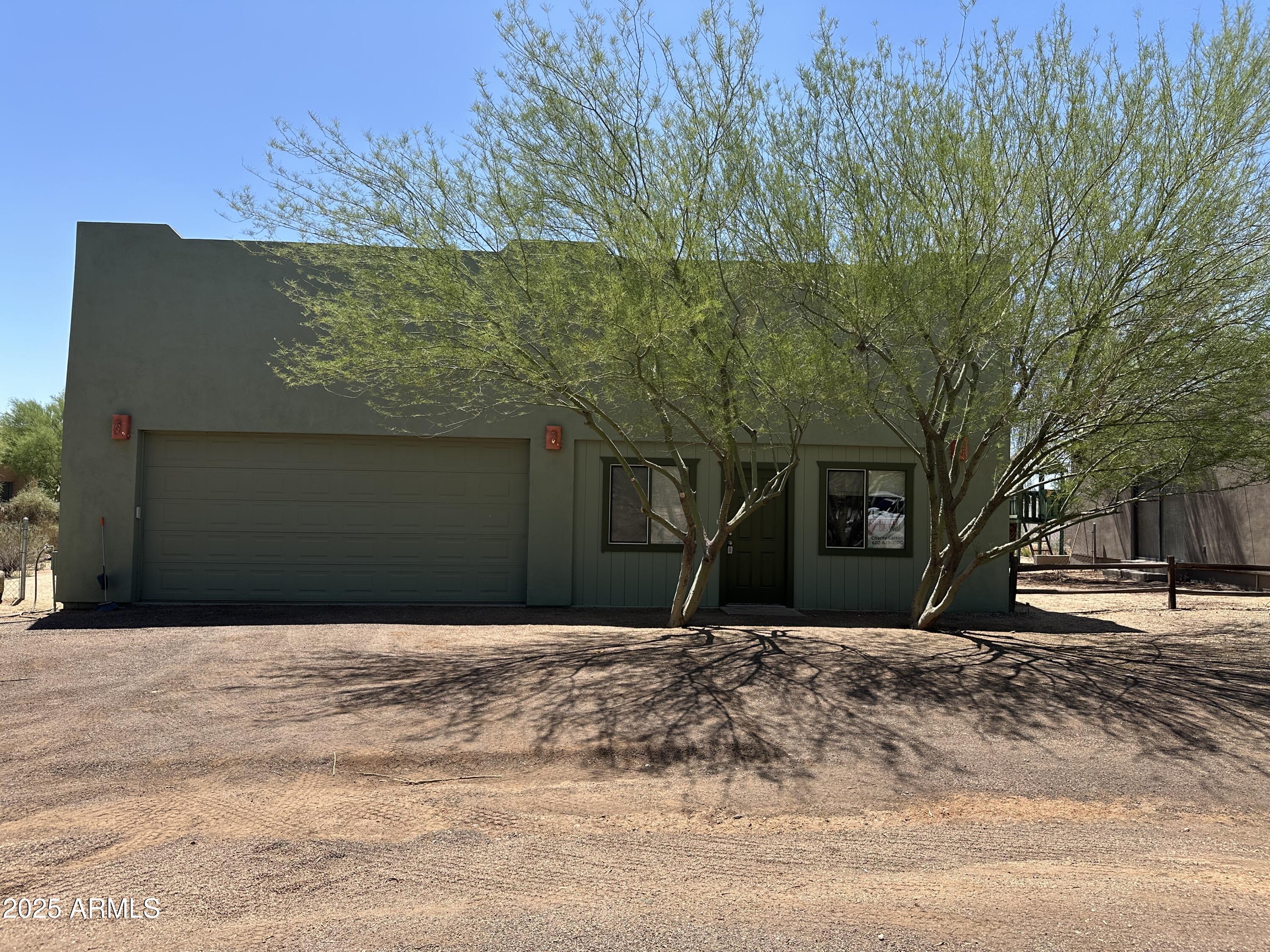 30814 North Sunrise Ranch Road, Unit GUEST Cave Creek, AZ 85331 - Photo 7 of 9 a front view of a house with a yard