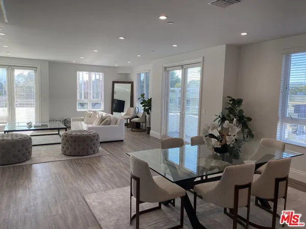 a living room with furniture or couch and a large window