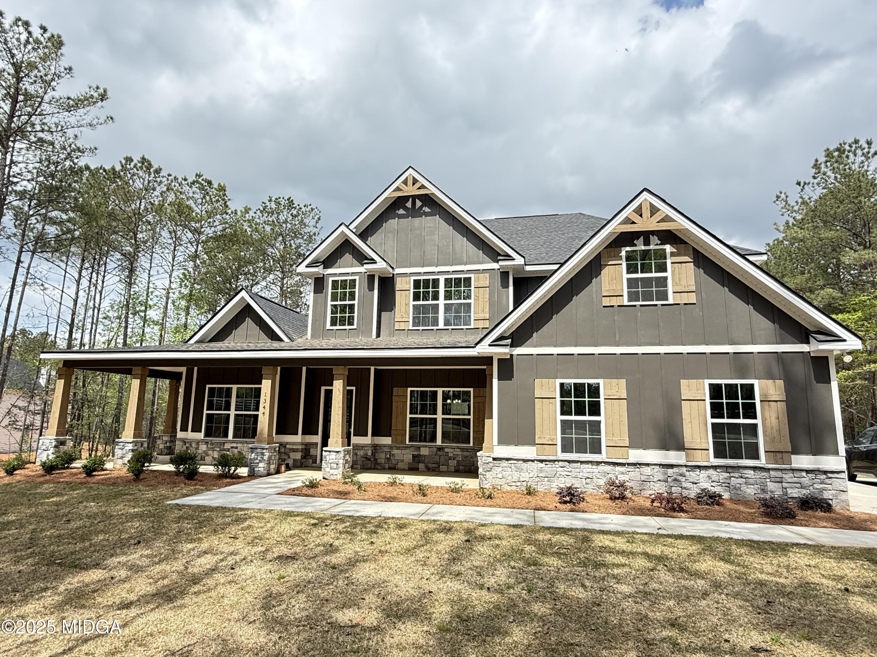 1344 Teagle Road Forsyth, GA 31029 - Photo 1 of 1 front view of a house with a yard
