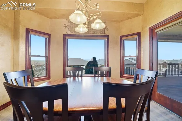 a view of a dining room with furniture window and wooden floor