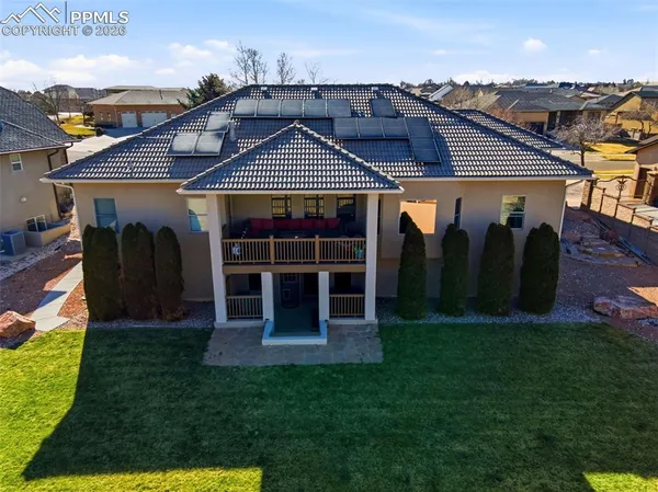 an aerial view of residential building with ocean view