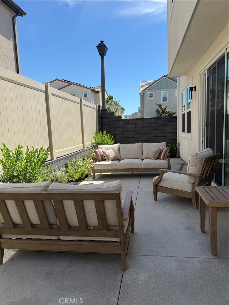 541 Jasper Street Rancho Mission Viejo, CA 92694 - Photo 11 of 20 a living room with furniture and a potted plant