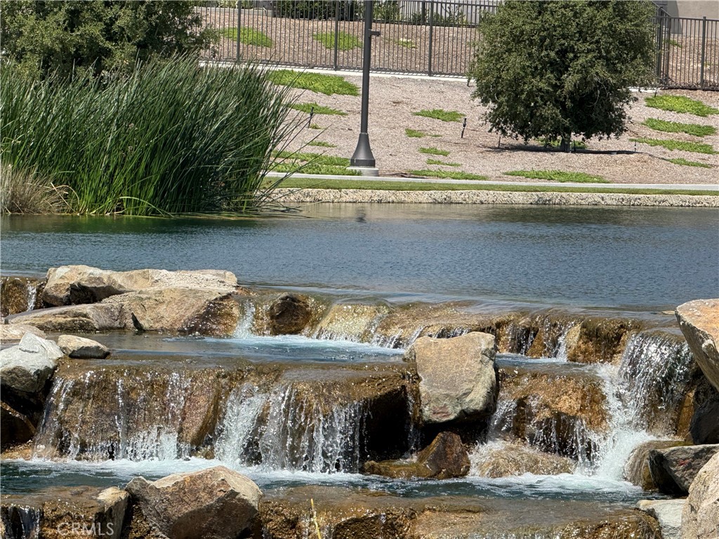 541 Jasper Street Rancho Mission Viejo, CA 92694 - Photo 14 of 20 a view of swimming pool with a yard and plants