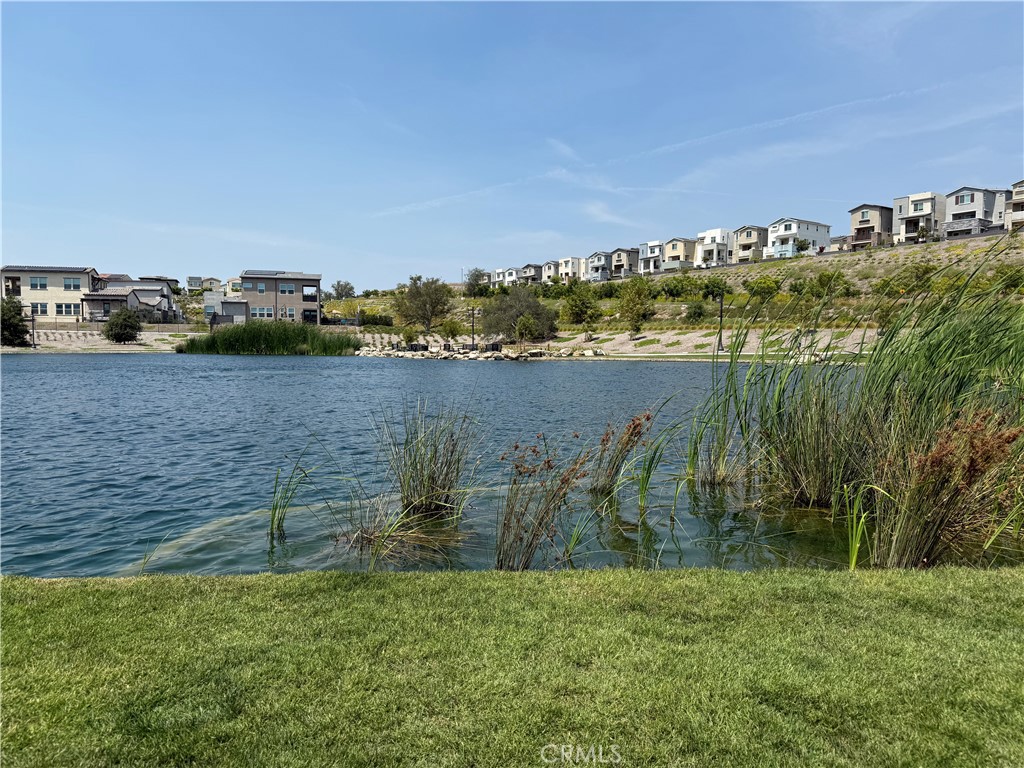 541 Jasper Street Rancho Mission Viejo, CA 92694 - Photo 15 of 20 a view of a lake with houses in the back