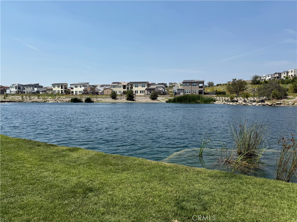 541 Jasper Street Rancho Mission Viejo, CA 92694 - Photo 16 of 20 a view of a lake with houses in the back