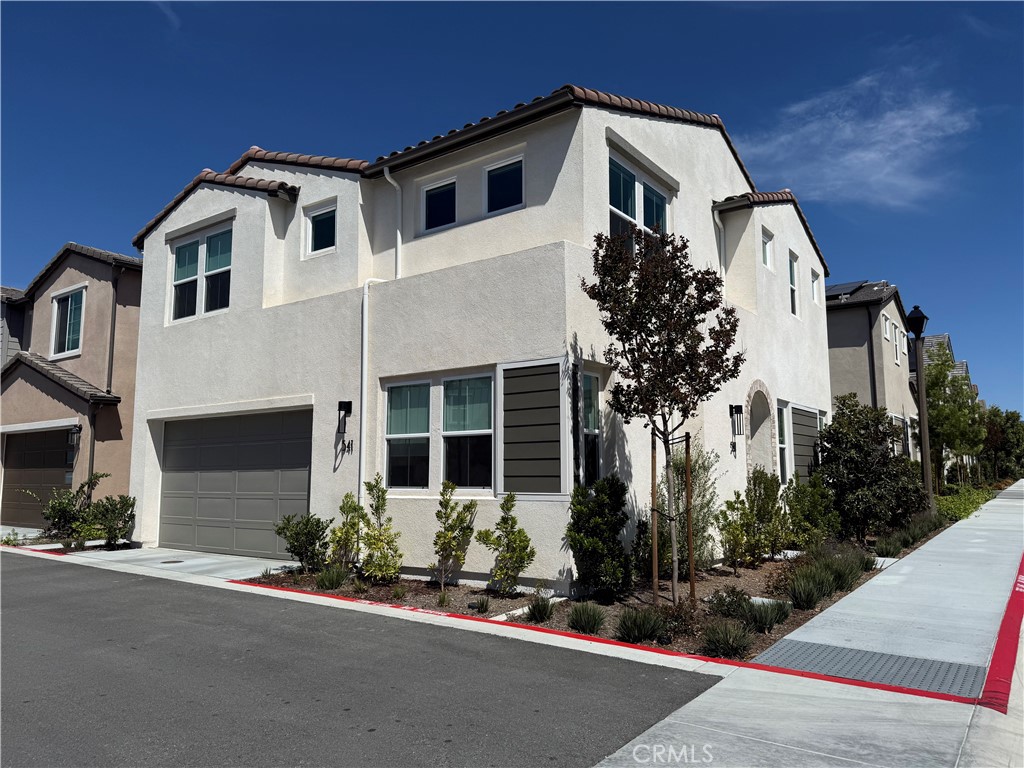 541 Jasper Street Rancho Mission Viejo, CA 92694 - Photo 2 of 20 a front view of a house with a yard