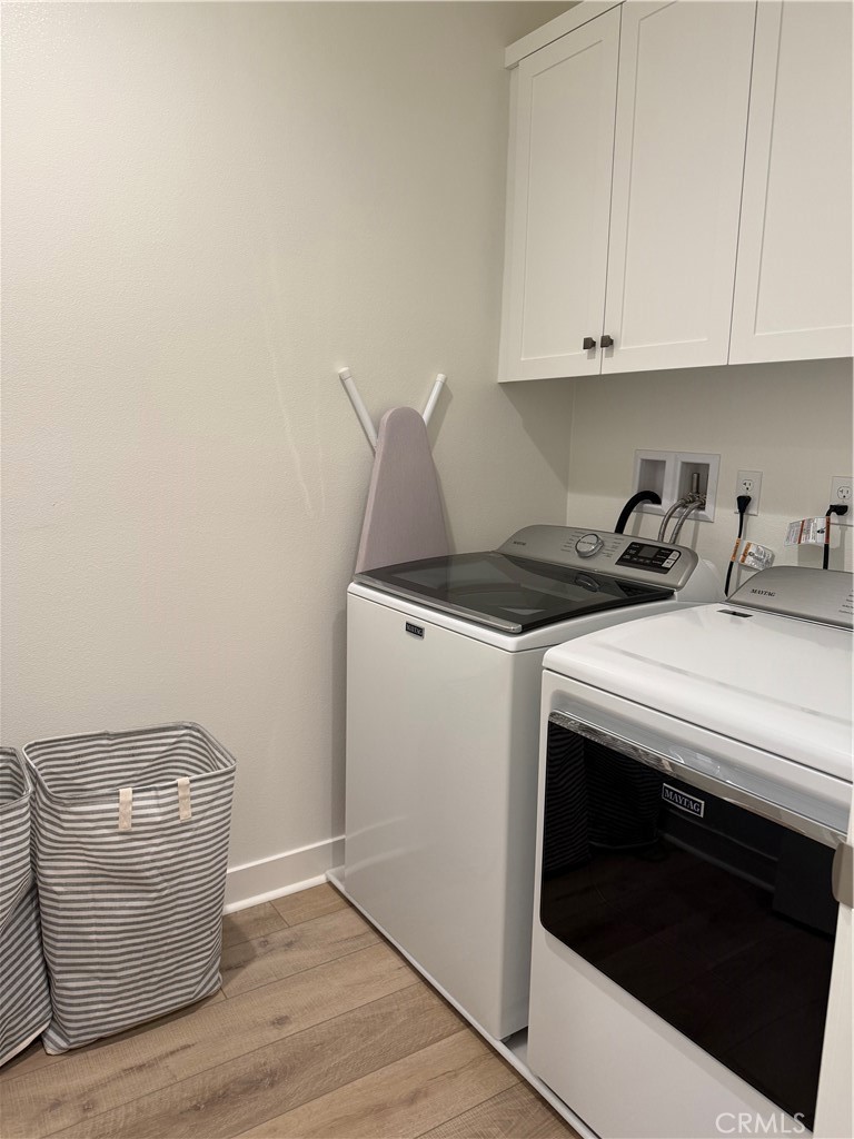 541 Jasper Street Rancho Mission Viejo, CA 92694 - Photo 9 of 20 a view of cabinets and wooden floor