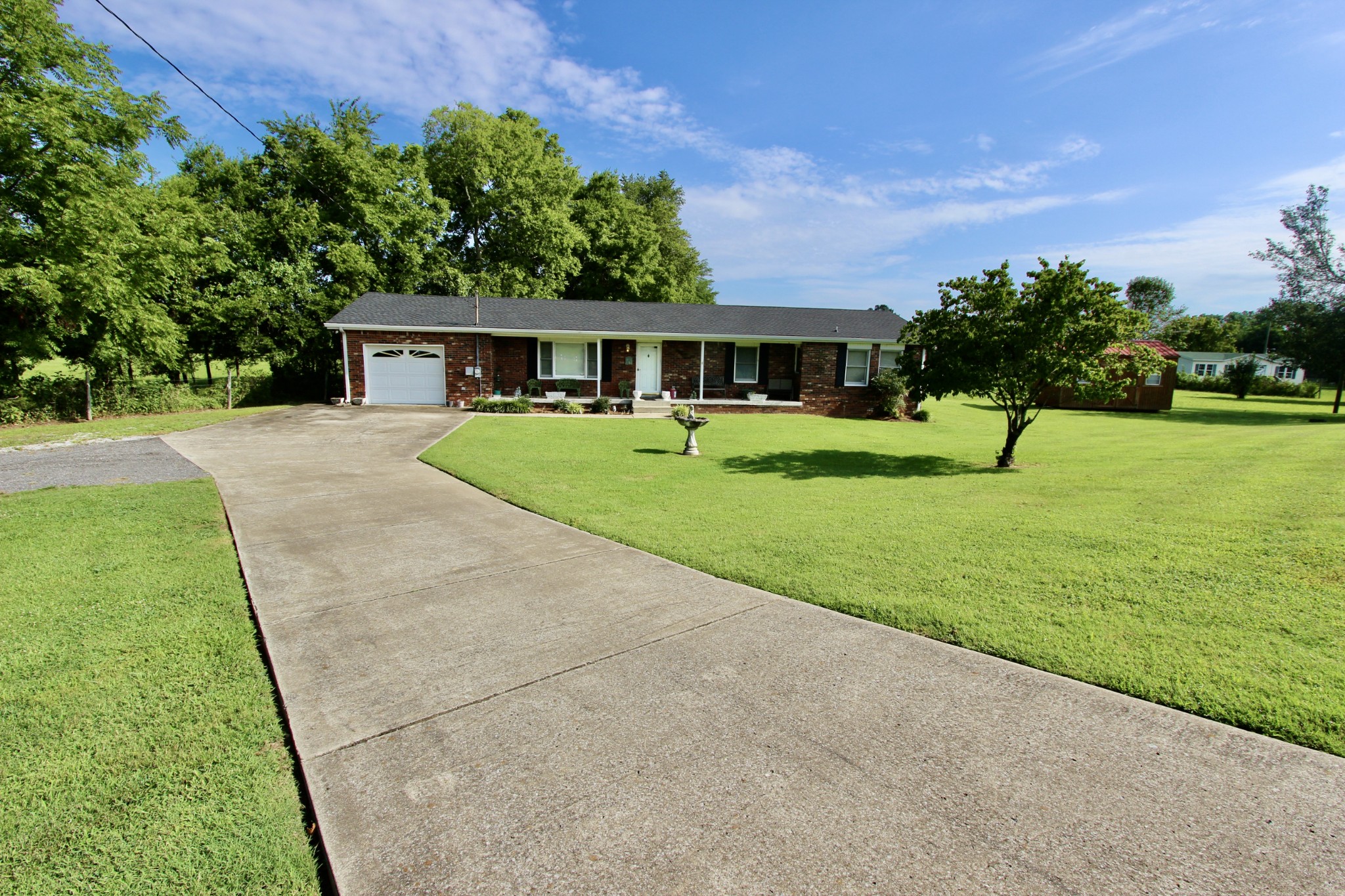 934 Maple Hill Road Lebanon, TN 37087 - Photo 1 of 9 a view of a house with a garden