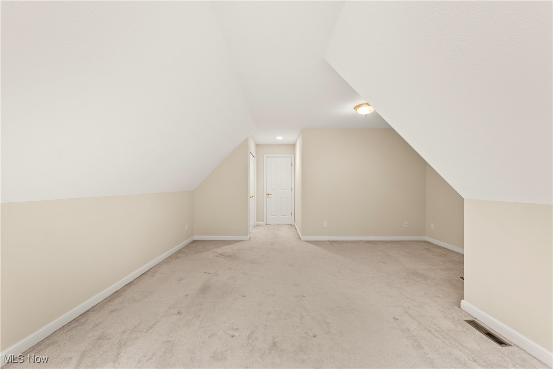 455 Old Reservoir Road Berea, OH 44017 - Photo 44 of 49 Additional living space with light colored carpet and vaulted ceiling