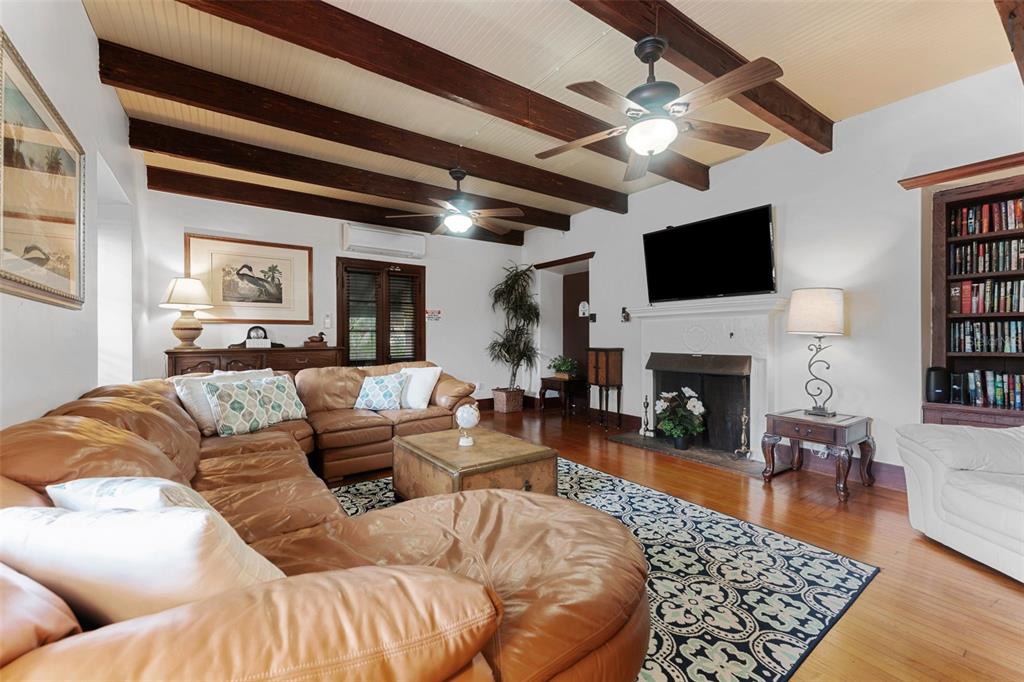 1500 Maple Street Clearwater, FL 33755 - Photo 16 of 96 a living room with furniture fireplace and a flat screen tv
