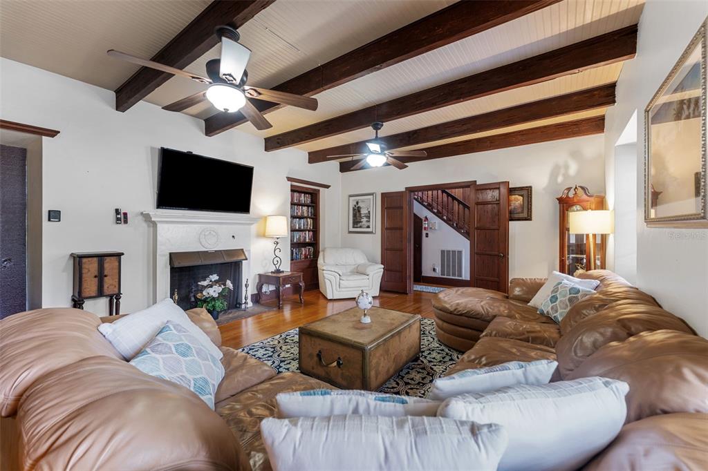 1500 Maple Street Clearwater, FL 33755 - Photo 18 of 96 a living room with furniture a fireplace and a flat screen tv