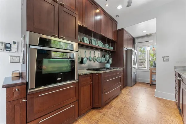 a bed room with a bed and a chandelier