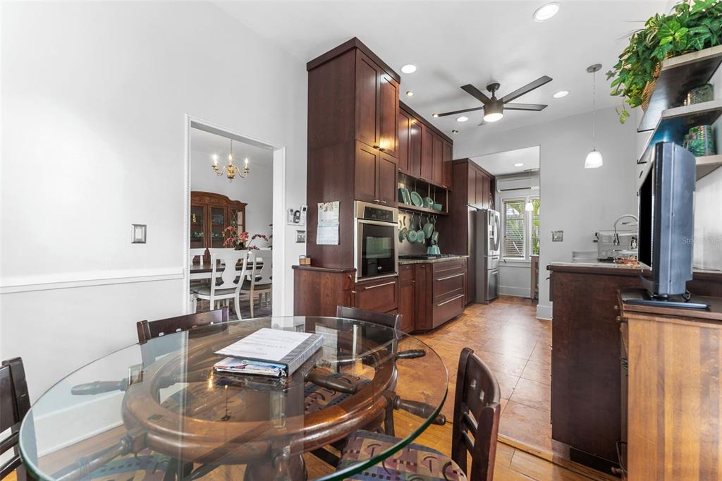 1500 Maple Street Clearwater, FL 33755 - Photo 25 of 96 a dining room with furniture and a kitchen view