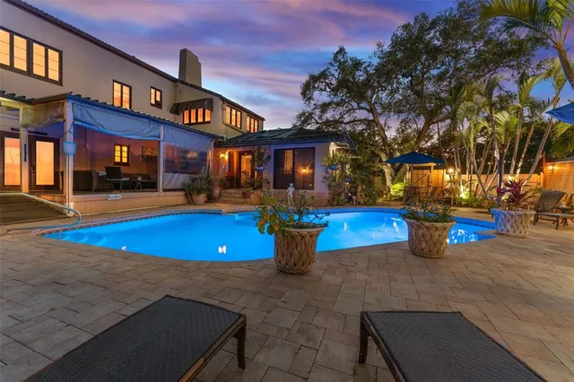 a view of a swimming pool with an outdoor space and seating area