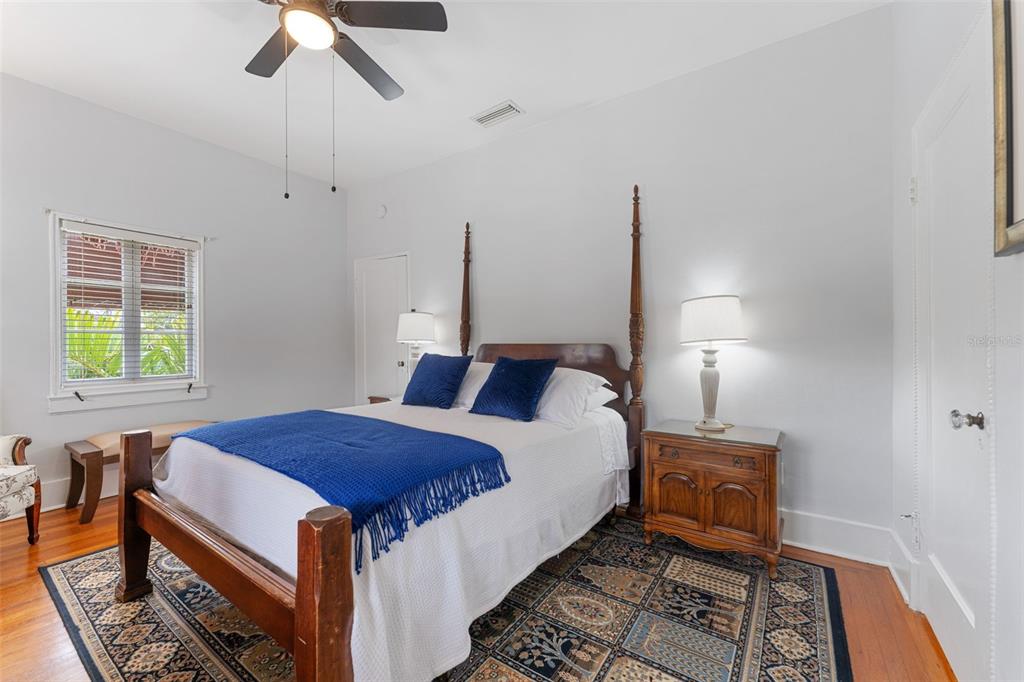 1500 Maple Street Clearwater, FL 33755 - Photo 37 of 96 a bed room with a bed and a chandelier