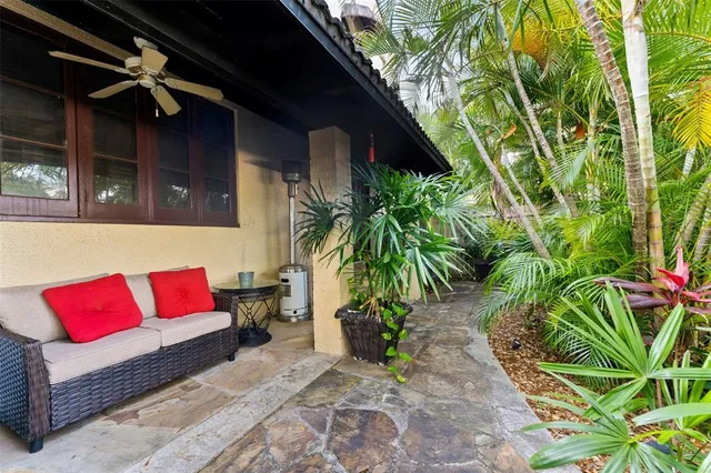 a backyard of a house with table and chairs