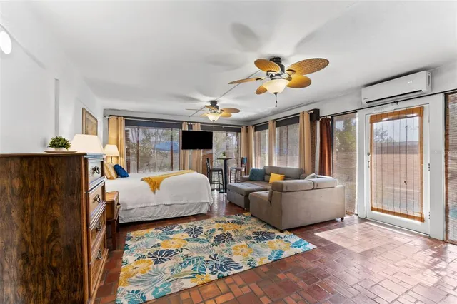 an aerial view of residential houses with outdoor space and swimming pool