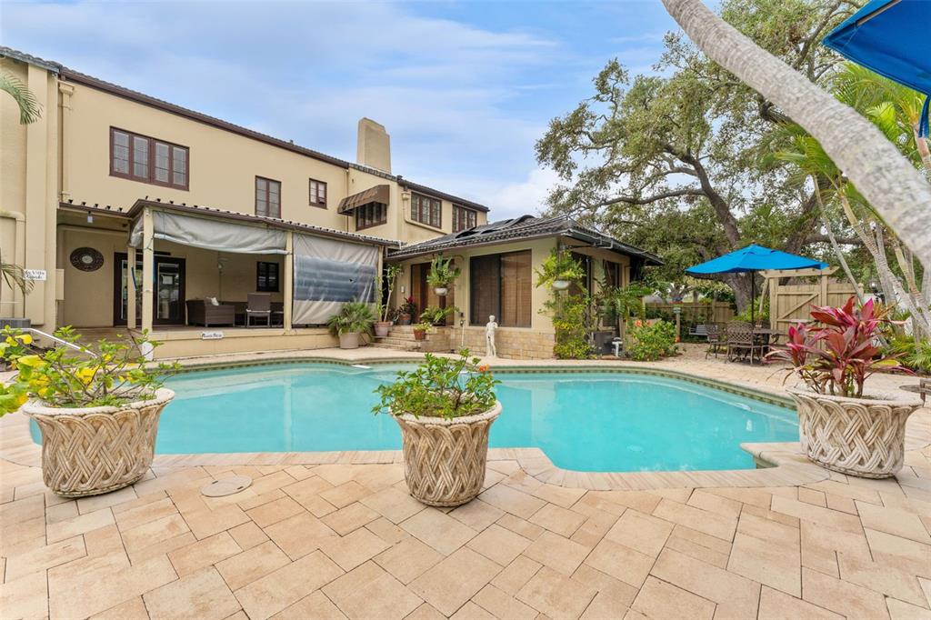 1500 Maple Street Clearwater, FL 33755 - Photo 58 of 96 a view of a house with sitting area and potted plants