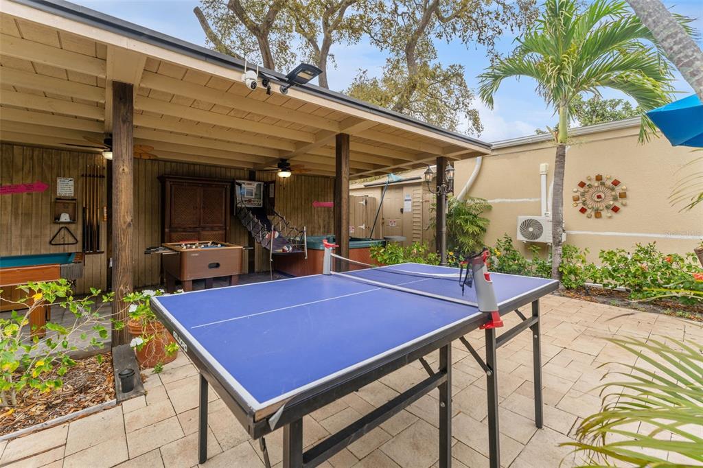 1500 Maple Street Clearwater, FL 33755 - Photo 66 of 96 a view of a patio with swimming pool table and chairs
