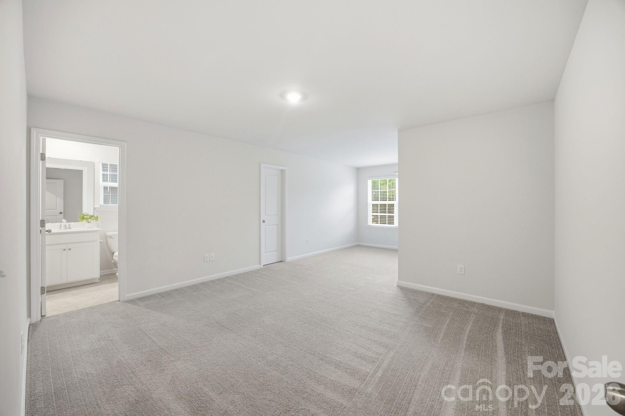234 Hamptons Cove Road Troutman, NC 28166 - Photo 22 of 32 an empty room with a bathroom and a sink