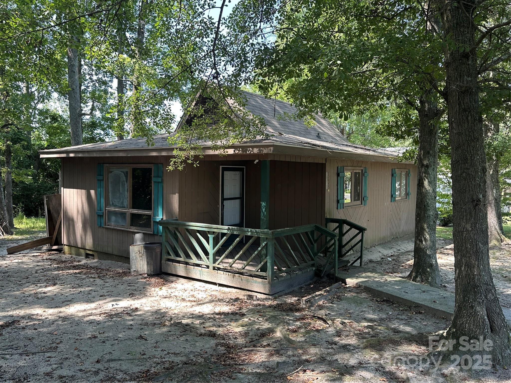 1014 Rockingham Road Rockingham, NC 28379 - Photo 3 of 8 a view of a house with backyard and sitting area