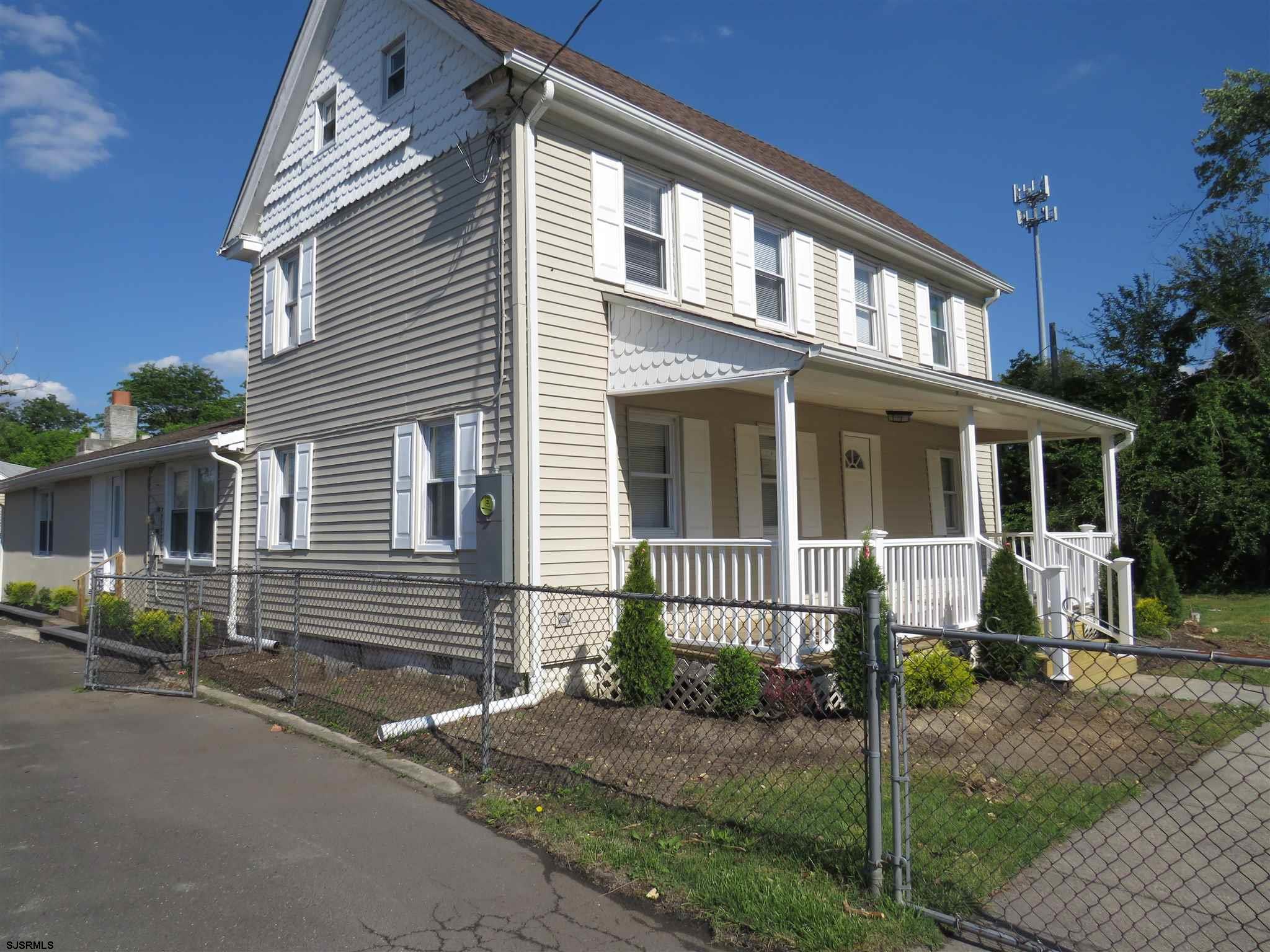 1702 Somers Point Road Egg Harbor Township, NJ 08234 - Photo 2 of 25 a front view of a house with a yard