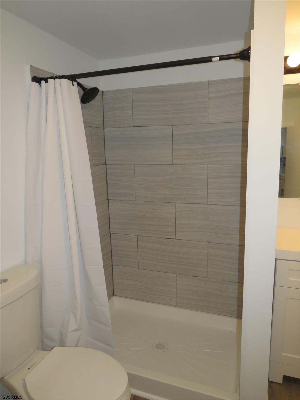 1702 Somers Point Road Egg Harbor Township, NJ 08234 - Photo 17 of 25 a bathroom with a shower and a toilet