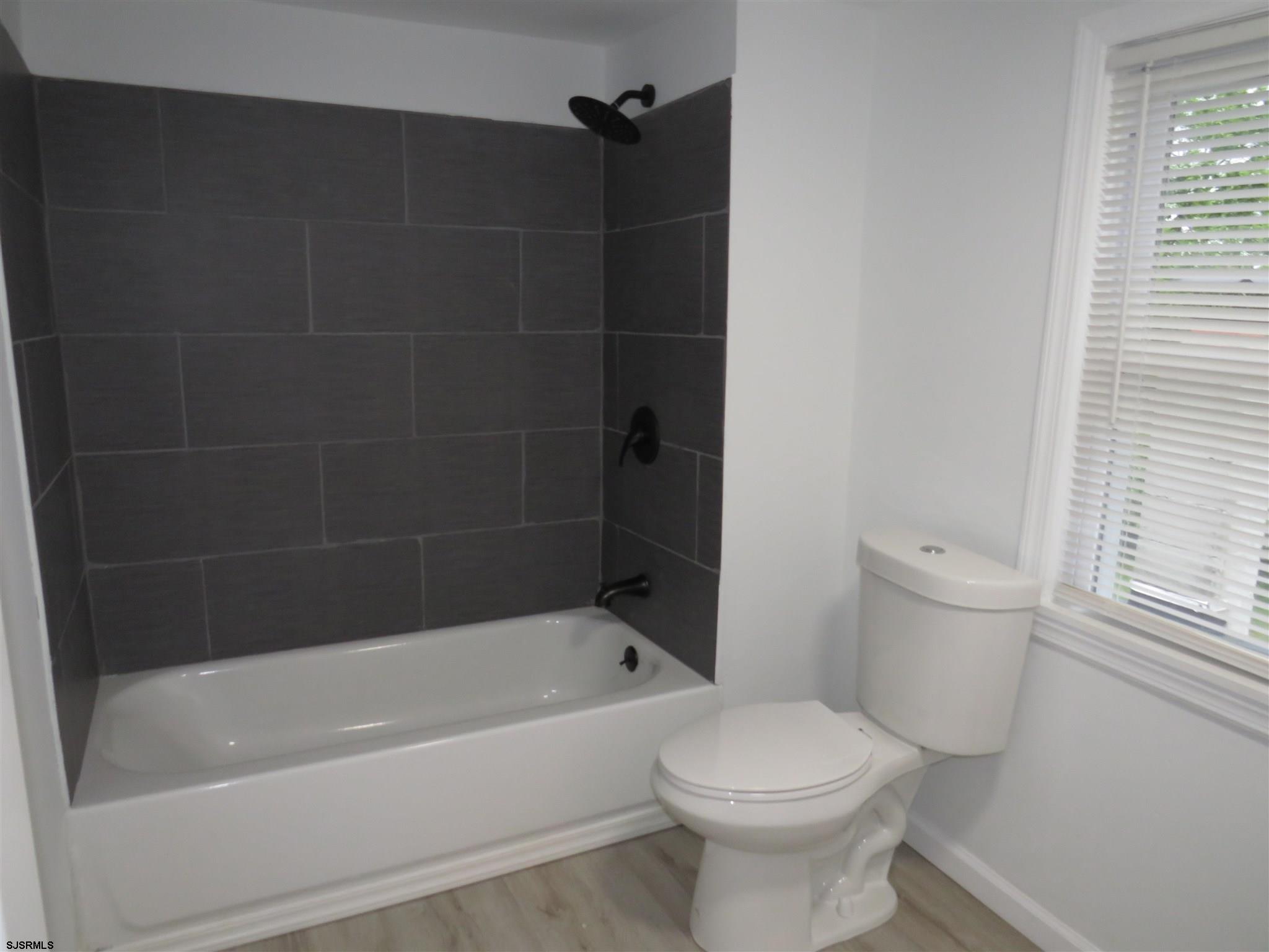 1702 Somers Point Road Egg Harbor Township, NJ 08234 - Photo 21 of 25 a bathroom with a toilet and a bathtub